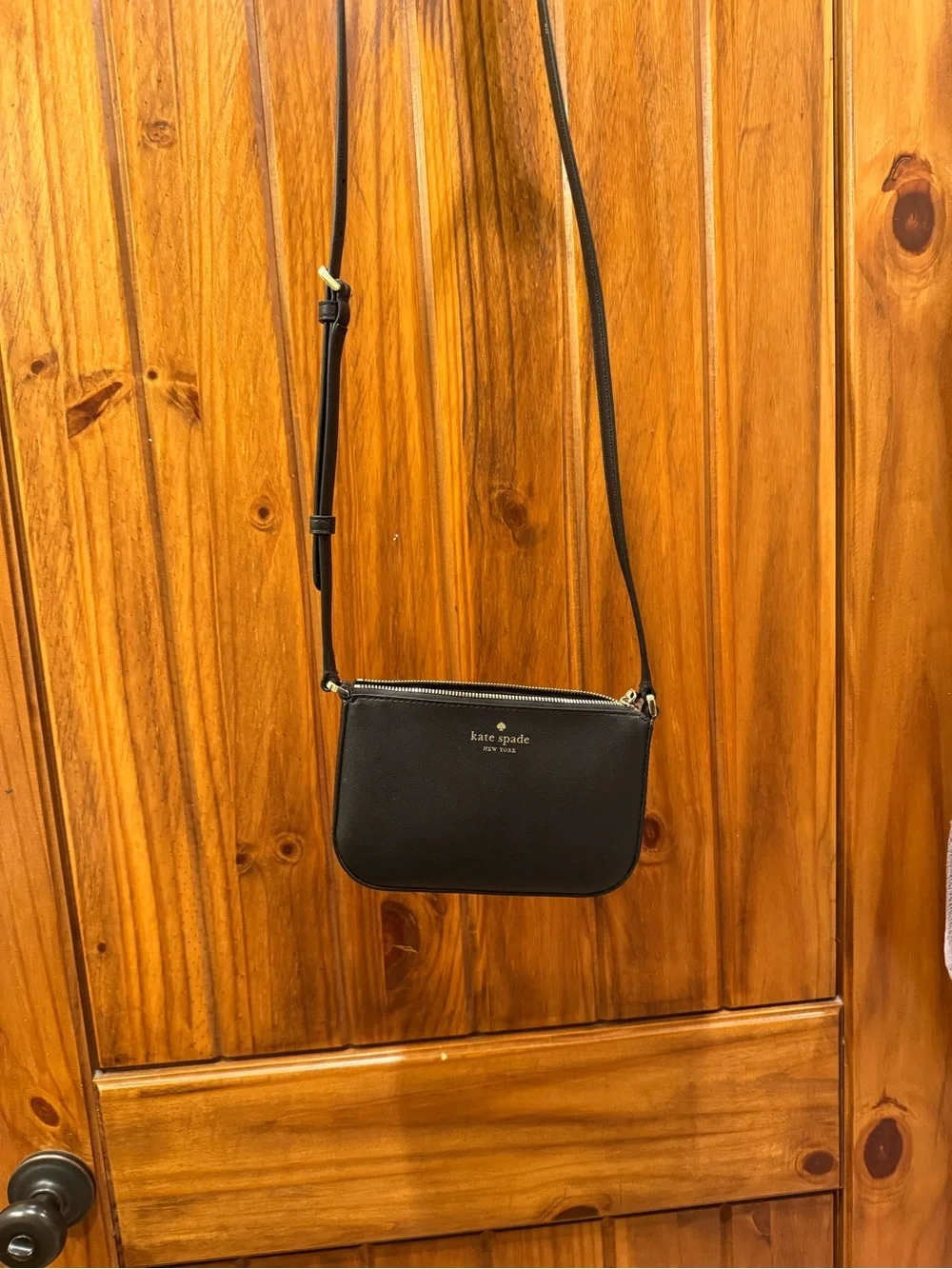 kate spade black saffiano crossbody with gold logo